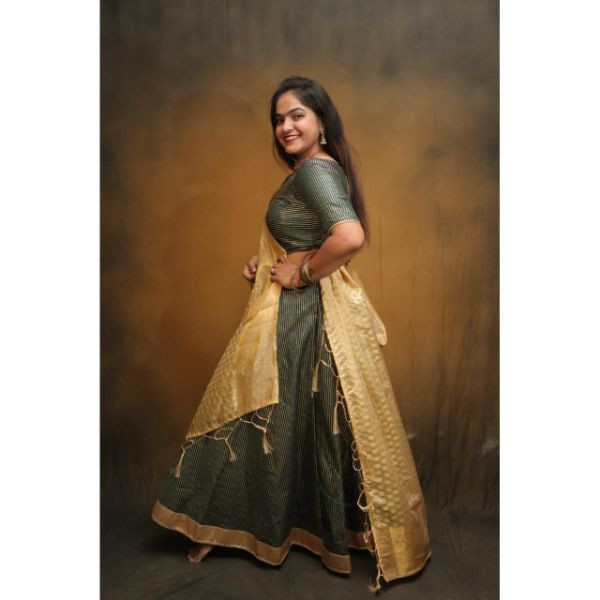"Enchanting Emerald: Green and Golden Choli With Lehenga for Rent" on rent