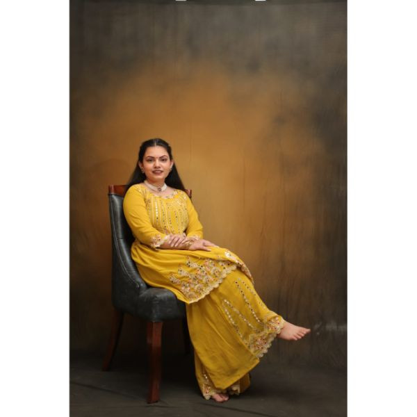 "Radiant Sunshine: Yellow Sharara Haldi Outfit"
 on rent