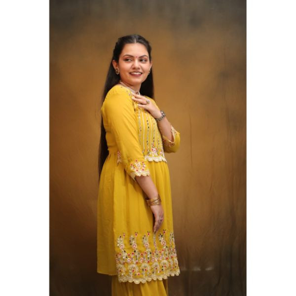 "Radiant Sunshine: Yellow Sharara Haldi Outfit"
 on rent