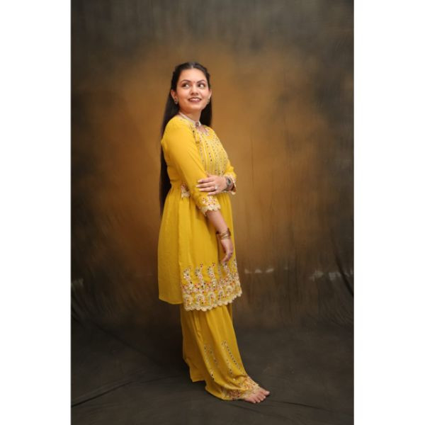 "Radiant Sunshine: Yellow Sharara Haldi Outfit"
 on rent