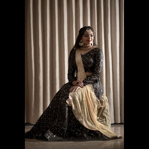 "Elegance Personified: Black Sequence Choli with Lehenga & 2 Dupattas" on rent