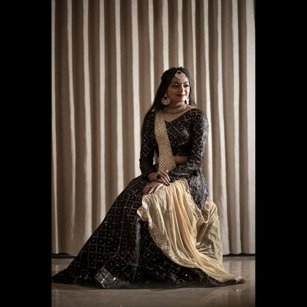 "Elegance Personified: Black Sequence Choli with Lehenga & 2 Dupattas" on rent