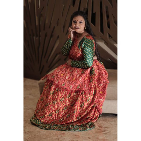 "Vibrant Elegance: Red & Green Bandhani Choli With Lehenga for Rent" on rent