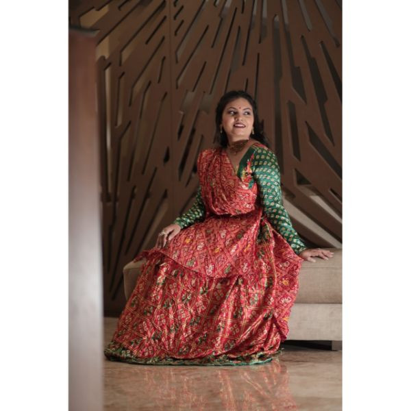 "Vibrant Elegance: Red & Green Bandhani Choli With Lehenga for Rent" on rent