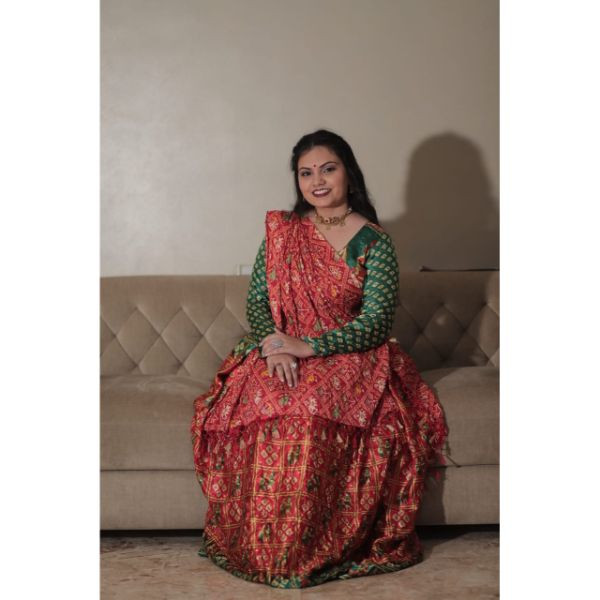 "Vibrant Elegance: Red & Green Bandhani Choli With Lehenga for Rent" on rent